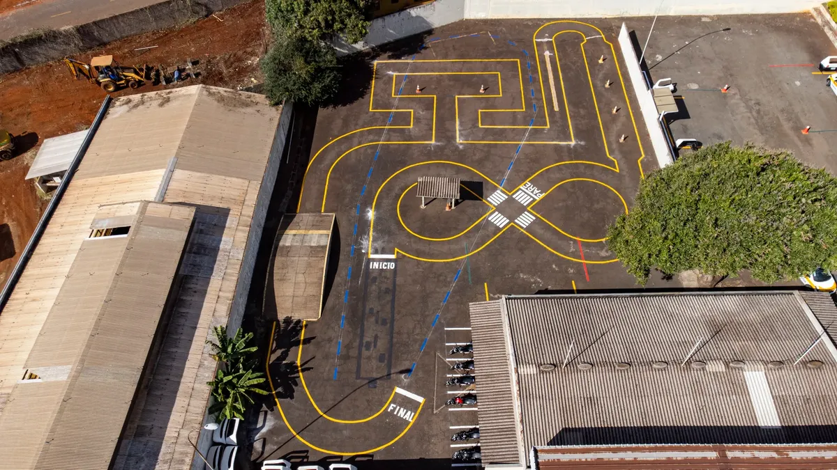 Aerial shot of a parking lot with traffic training markings in Londrina, Brazil.